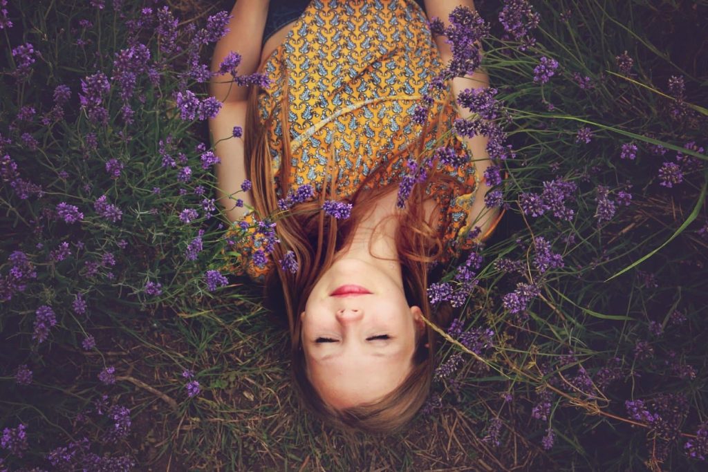 woman photography on purple flower