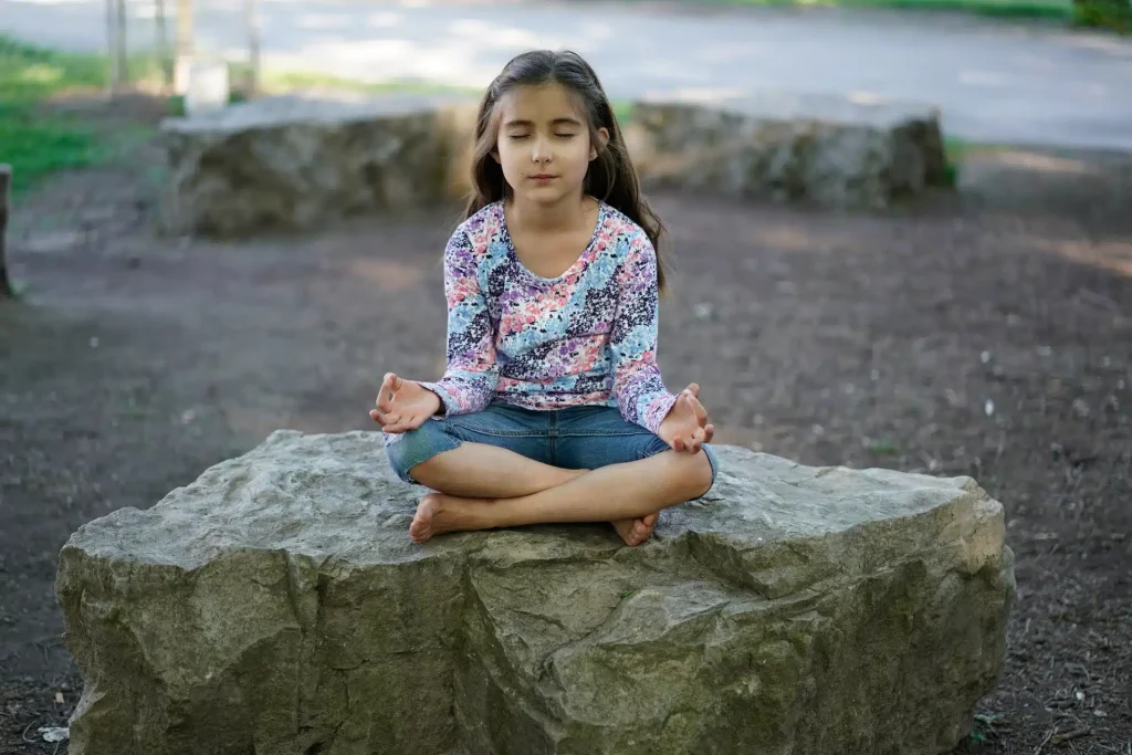 child doing meditation